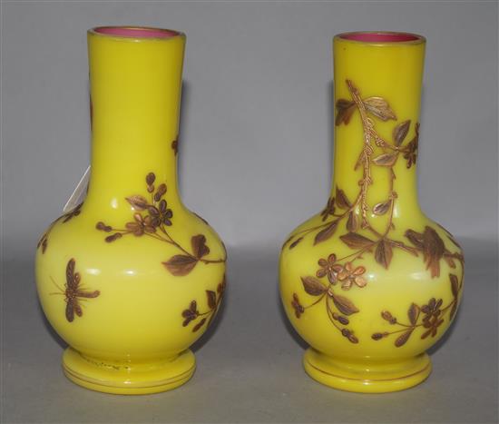 A pair of yellow glass gilt enamelled vases